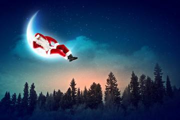 photo of santa claus sitting on the moon