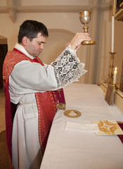 priest with the cap at tridentine mass - transfiguration