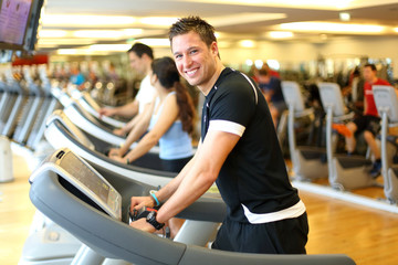 Man on treadmill smiling