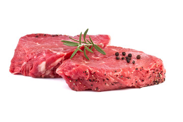 raw beef steak with green herbs