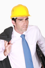 Skeptical businessman in a hardhat
