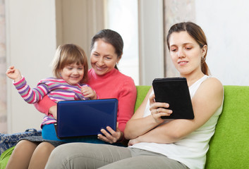 Fototapeta na wymiar Happy family with electronic devices