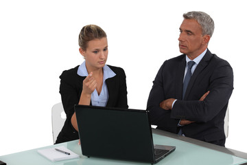 Boss and hiss young employee working together