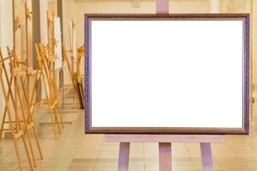 big picture frame on easel in gallery hall
