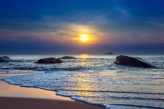 Fototapeta Sunset on Khao Lak beach in Thailand.