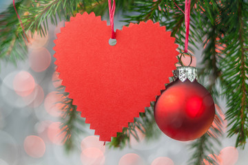 Christmas card with heart, ball and spruce twig