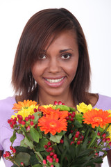 Young brunette with flowers