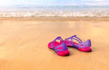 Sandals on the beach - concept image