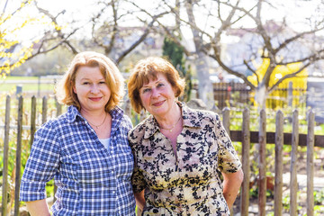 mother and daughter, red haired looking confident and happy