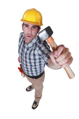 Builder holding hammer