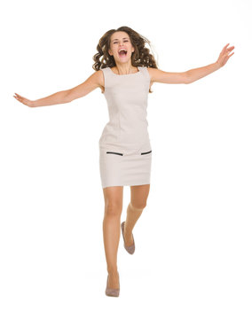 Young Woman In Dress Jumping Forward