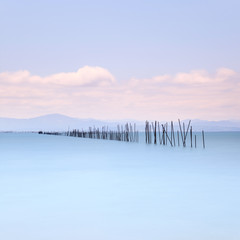 Fototapety  Wędki i miękka woda na morskim krajobrazie. Długa ekspozycja.