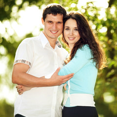 Fototapeta premium Young happy couple in the park