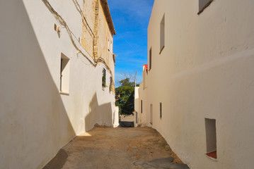 Fototapeta na wymiar Brukowiec ulicy w Vejer, hiszpański białe miasteczko.