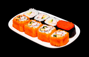 sushi in white plate on black background