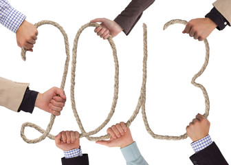 Hands holding rope forming year 2013
