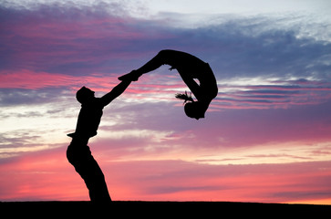 circus artists in sunset