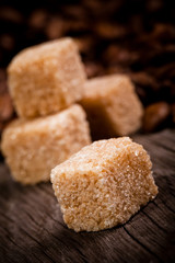 Macro shot of brown sugar on wooden surface