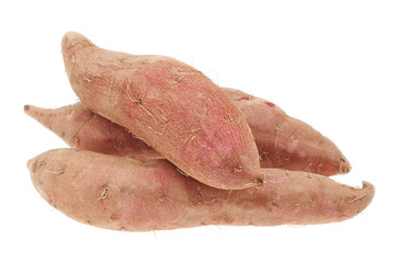A stack of sweet raw potatoes on a white background.