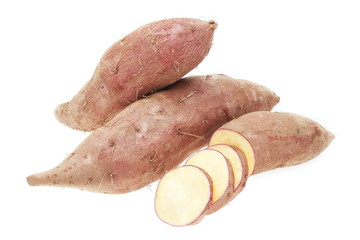 Sweet potatoes sliced ​​raw close-up on a white background.