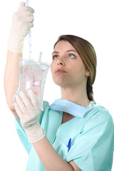 Female nurse administering a drip