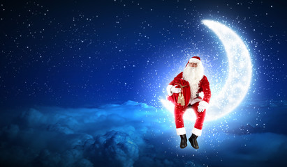 Obraz na płótnie Canvas Zdjęcie Santa Claus siedzi na księżycu