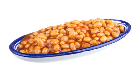 Marinated haricot beans in tomato sauce with shallots on a plate