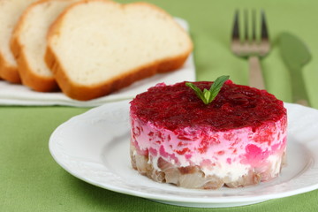 Traditional Russian salad with herring.