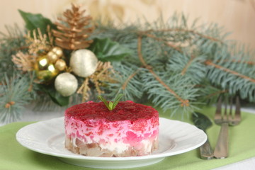 Russian salad with herring. Christmas table setting