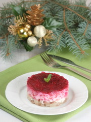 Russian salad with herring. Christmas table setting
