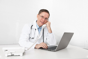 Medical doctor working in office.