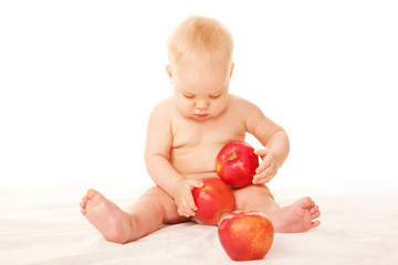 Fototapeta na wymiar Baby with big red apples Isolated on white