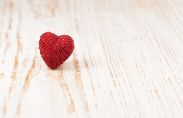 Heart on wooden background