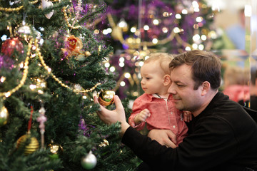 Family looking at Christmas tree