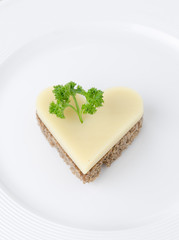 appetizer with bread and cheese in the shape of heart