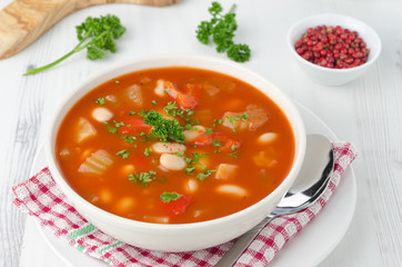 bowl of roasted tomato soup with beans, celery and bell pepper