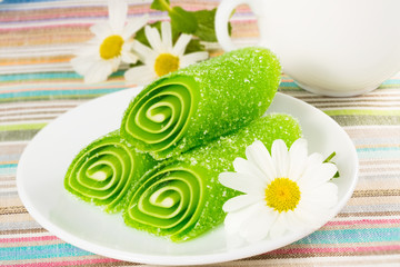 green candy fruit on a plate