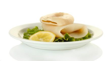 Fototapeta na wymiar boiled squids with lettuce and lemon in the plate isolated