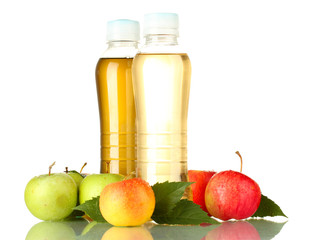 Naklejka na ściany i meble two bottles of juice with sweet apples, isolated on white