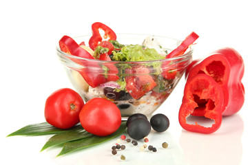 Fresh greek salad in glass bowl isolated on white