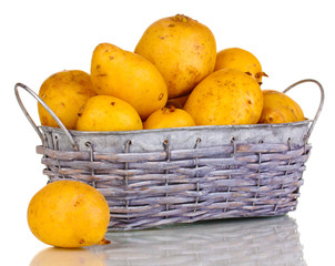 Ripe potatoes on basket isolated on white