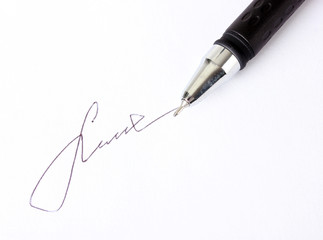 Closeup of signature (fake, not real) and pen, isolated on