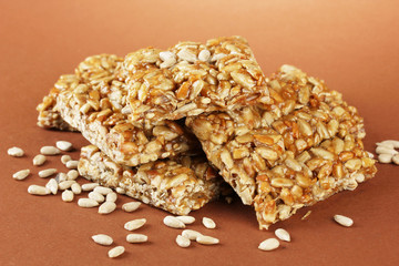 tasty sweets (kozinaki), on brown background