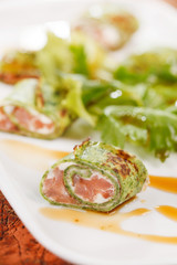 tasty appetizer with salmon and cheese