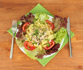 Tasty italian pasta with seafood on wooden background
