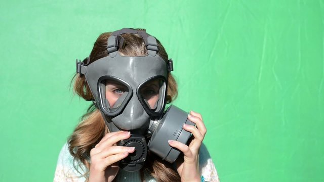nuclear war. Girl dress gas masks. green screen.