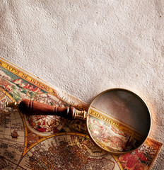 Magnifying glass on old parchment.