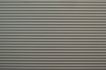 Obraz premium Ribbed aluminium background with strip pattern
