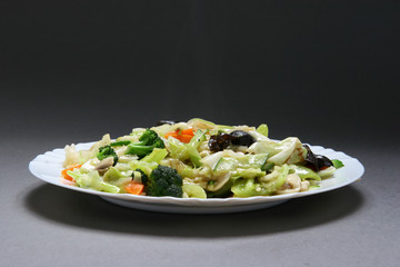 cooked vegetables with black and white mushrooms