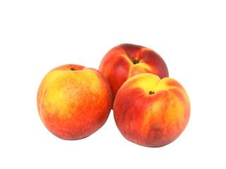 Three peaches on white.Isolated